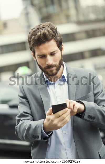 Man orders a taxi\
from his mobile phone