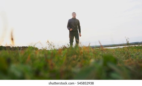 man outdoors playing sports yoga gymnastics healthy lifestyle sport - Powered by Shutterstock