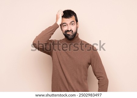 Man over isolated background with an expression of frustration and not understanding