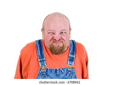 Man in overalls with grumpy face