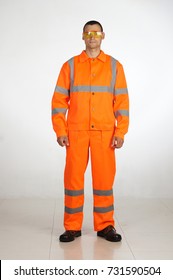 A Man In Overalls And Work Wear.Isolated Studio Portarit