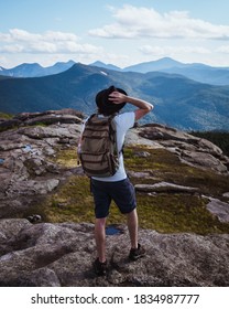 Man overlooking view of mountain range