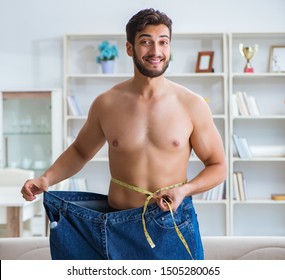 Man In Oversized Pants In Weight Loss Concept