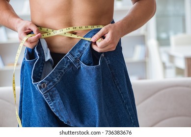 Man In Oversized Pants In Weight Loss Concept