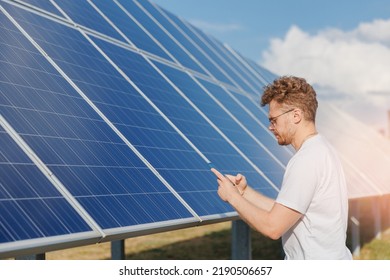 Man Owner Analyzing Data On Phone Background Solar Panel Power Station.
