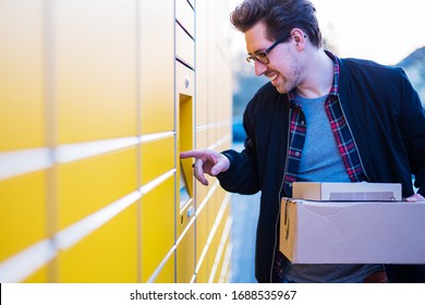 
A man at a packing station, picking up and dropping off parcels