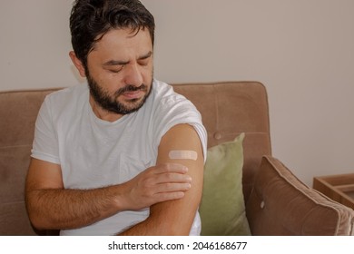 Man With Pain In Arm After Vaccination.