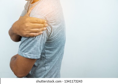 Man with pain in shoulder and upper arm, Ache in human body , closeup  - Shutterstock ID 1341173243