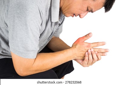 Man With Painful And Inflamed Gout On His Hand Around The Thumb Area.