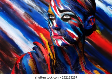 Man painted with colored inks. Fashion body art.