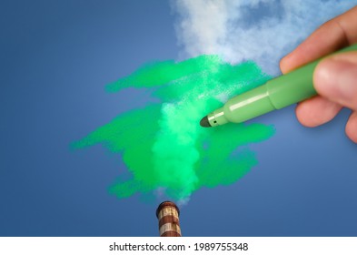 Der Mensch malt grüne Verschmutzung aus einem Schornstein