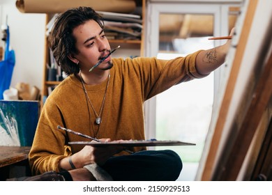 Man Painting Picture In His Atelier