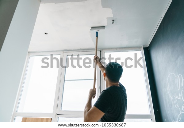 Man Paints Walls Ceiling Gray Color Stock Photo Edit Now 1055330687