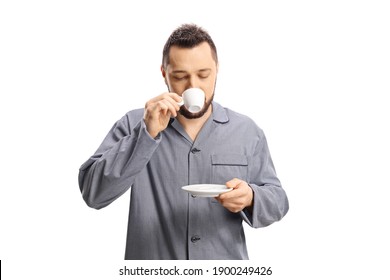 Man In Pajamas Drinking A Cup Of Espresso Coffee Isolated On White Background