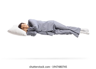 Man in pajamas sleeping on cloud and floating isolated on white background
