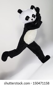 Man In Panda Costume Over White Background