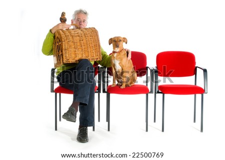Man with parrot, cat and dog in the waitingroom from the veterinary