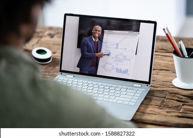 Man Participating In Online Coaching Session Using Laptop
