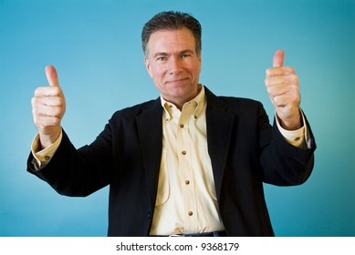 A man with passionate body language giving a "thumbs up".