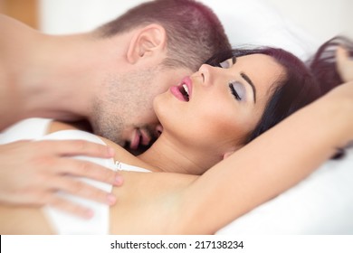 Man passionately engaged in sex with a beautiful girl