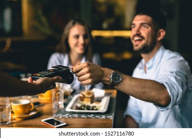 Man Paying Bill At Fancy Restaurant