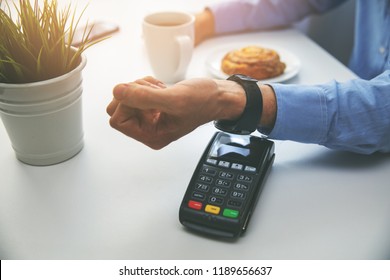 man paying bill with smartwach at restaurant - Powered by Shutterstock