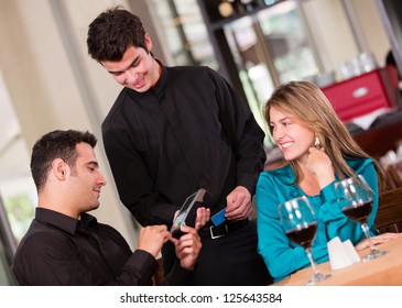 Man Paying By Credit Card At A Restaurant