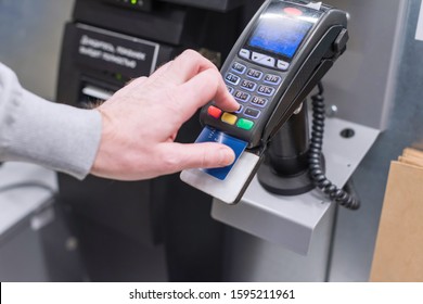 Man Paying At The Self-service Counter Entering Credit Card Pin Code For Security Password In Credit Card Swipe Machine. Shopping Time 