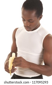 A Man Peeling His Banana Eating Healthy.