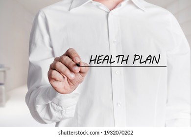 Man With Pen Underlines The Words Health Plan On A Virtual Screen.