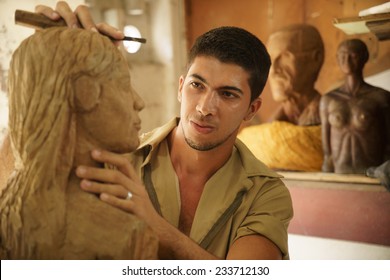 Man, People, Job, Young Student At Work Learning Craftsman Profession In Art Class, Working With Wooden Statue And Carving Wood