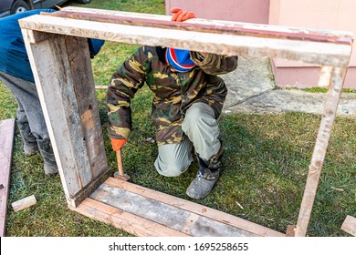 Man People Working On Vegetable Winter Garden For Raised Bed Cold Frame In Ukraine Dacha Holding Equipment Hammer