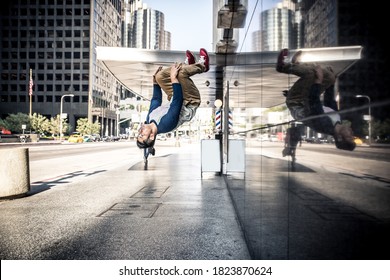 Man Performing Parkour Tricks In The Urban Center