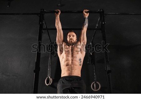 Man performing pull ups on bars, challenging bodyweight exercise. Bodyweight workout for physical and mental health.