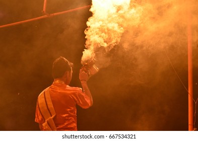 Man Performing With Smoke At Aarti Ceremony In The Ganges River In Varanasi, India