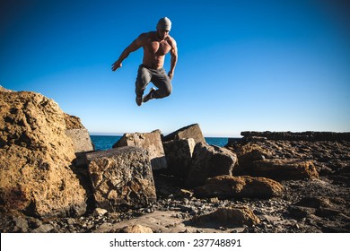 Man Performs Freerunning Jump On Stones