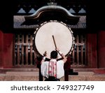 A man performs traditional Japanese Taiko drum.