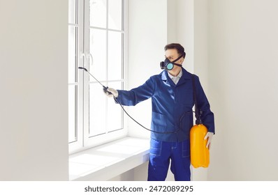 Man from the pest control service sprays insecticide around the house, targeting pests like bugs and termites. This thorough treatment ensures effective insect elimination and protection for the home.