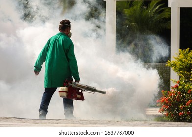 Man Pesting Gardens To Fight The Dengue And Yellow Fever Mosquito In Brazil. Bug Fumigation.