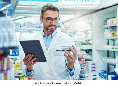 Man, pharmacist and box with tablet for prescription, side effects or symptoms at pharmacy, Mature male person or medical employee reading pharmaceuticals, inventory or checking stock with technology