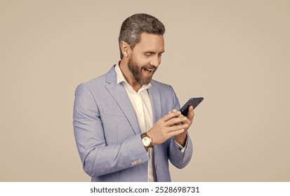 Man phone conversation in studio. happy hispanic business man with phone. Business communication. Casual business man chatting on phone isolated on grey. Businessman using phone - Powered by Shutterstock