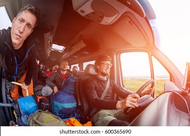 man photographer taking selfie in the bus with happy funny smiling driver - Powered by Shutterstock