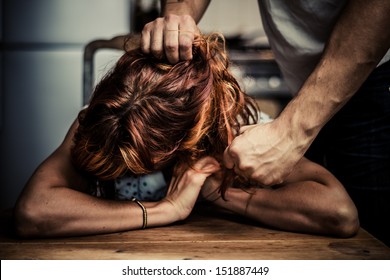 man physically abusing his girlfriend