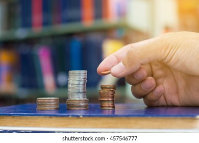 Man pick coin to set a row - Shutterstock ID 457546777
