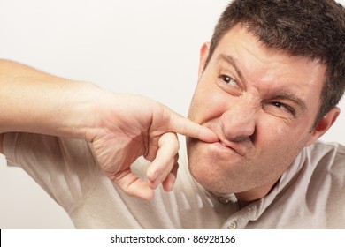 Man Picking Food From His Teeth