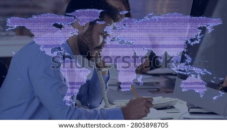 Man picking up ringing phone and writing notes for call in business, holographic map shifting. Office, openplan, collaboration, focus, modern, teamwork, monitor