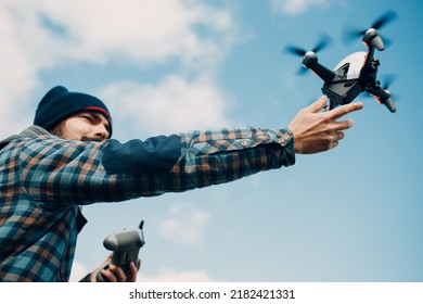 Man pilot Launches quadcopter FPV drone from hand to sky flight
