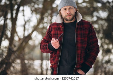 Man with pipe outside