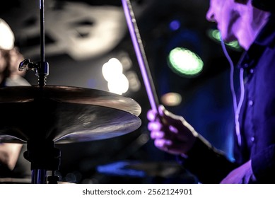 Man play drum kit musician drummer performs at concert in nightclub bar - Powered by Shutterstock