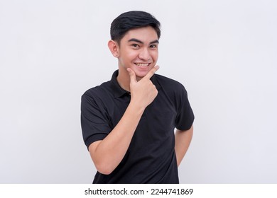 A man playfully makes the pogi sign while smiling. Isolated on a white background. - Shutterstock ID 2244741869